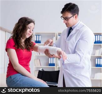 The doctor and patient during check-up for injury in hospital. Doctor and patient during check-up for injury in hospital