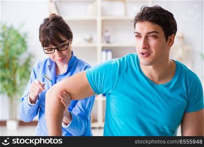 The doctor checking nerve reflexes with hammer. Doctor checking nerve reflexes with hammer