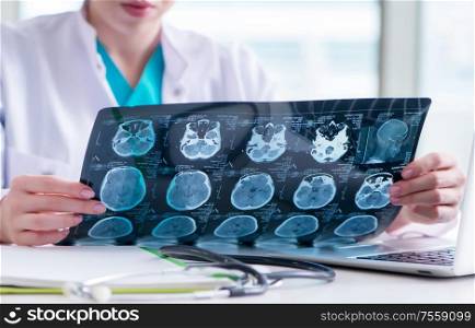 The doctor examining mri image in hospital. Doctor examining MRI image in hospital