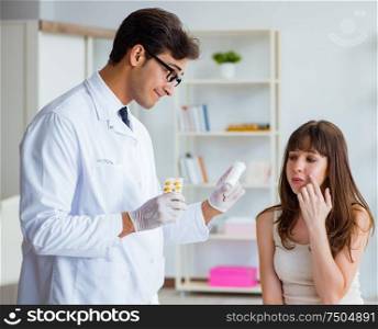 The doctor examining the skin of female patient. Doctor examining the skin of female patient