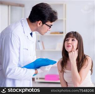 The doctor examining the skin of female patient. Doctor examining the skin of female patient