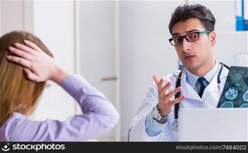 The doctor examining x-ray images of patient. Doctor examining x-ray images of patient