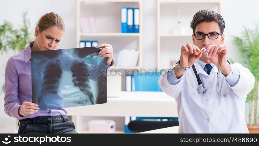 The doctor examining x-ray images of patient. Doctor examining x-ray images of patient