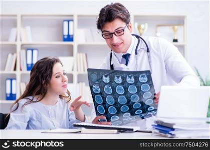 The doctor explaining to patient results of x-ray imaging. Doctor explaining to patient results of x-ray imaging