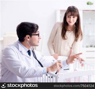 The doctor explaining to young mother. Doctor explaining to young mother