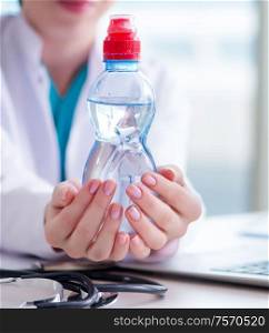 The doctor hand with fresh water in medical concept. Doctor hand with fresh water in medical concept