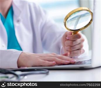 The doctor hand with magnifying glass. Doctor hand with magnifying glass