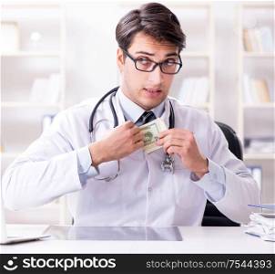The doctor in corruption concept with being offered bribe. Doctor in corruption concept with being offered bribe