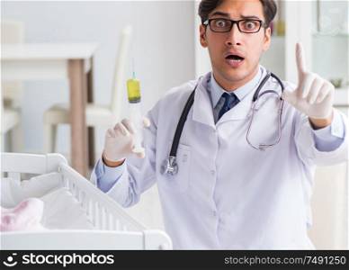 The doctor preparing for baby vaccination. Doctor preparing for baby vaccination
