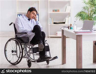 The doctor resting on wheelchair in hospital after night shift. Doctor resting on wheelchair in hospital after night shift