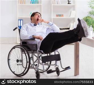 The doctor resting on wheelchair in hospital after night shift. Doctor resting on wheelchair in hospital after night shift