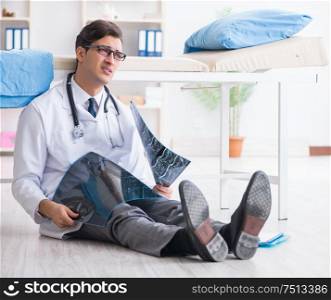 The doctor sitting on the floor in hospital. Doctor sitting on the floor in hospital