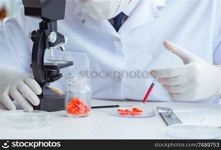 The doctor testing new drugs for medical purposes. Doctor testing new drugs for medical purposes