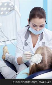 The doctor treating your child?s teeth in the dental clinic