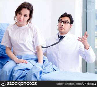 The doctor visiting patient in hospital room. Doctor visiting patient in hospital room