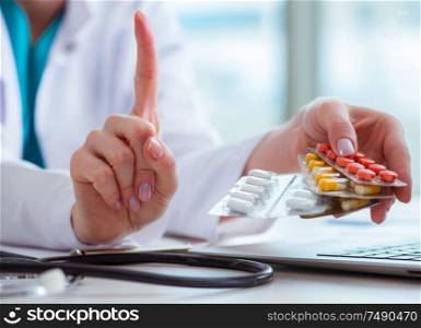 The doctor with prescribed medicines in medical concept. Doctor with prescribed medicines in medical concept