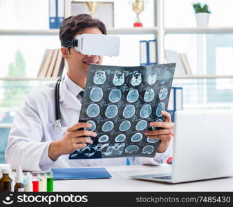 The doctor working with virtual vr reality glasses. Doctor working with virtual VR reality glasses