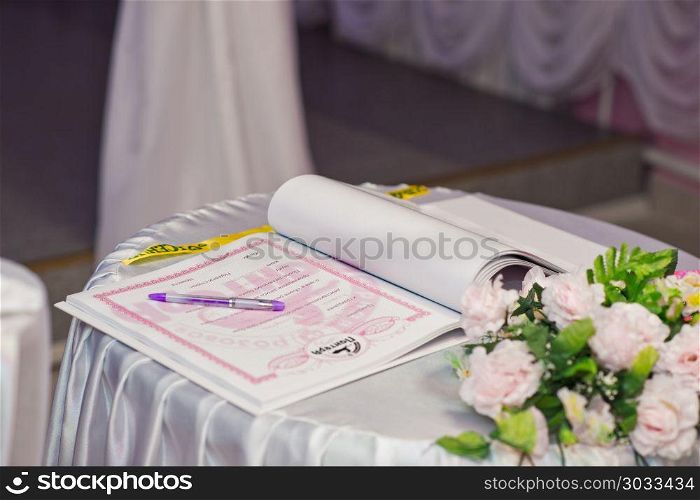 The document on a marriage on a table before signing.. The document on a table. 912