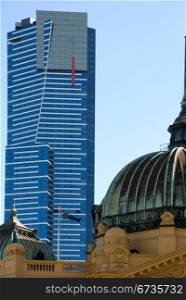 The dome of Flinders Street Railway Station, with the mighty Eureka Tower in the background