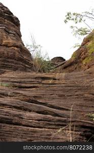 the Domes de Fabedougou are natural phenomenon of rock sculpted by wind and erosion in Burkina faso look like a stack of pancakes