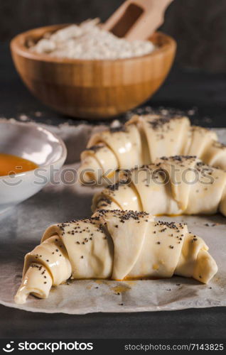 The dough for croissants. Preparation of croissants in the kitchen with ingredients