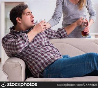 The drinking problem drunk husband man in a young family concept. Drinking problem drunk husband man in a young family concept