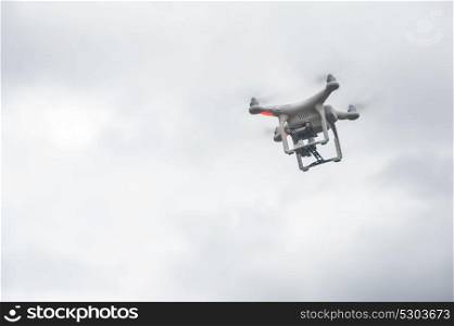 The drone copter with digital camera. The flying drone copter with digital camera