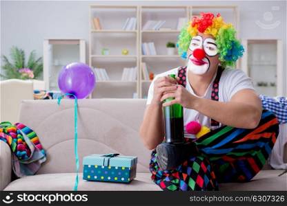 The drunk clown celebrating having a party at home. Drunk clown celebrating having a party at home