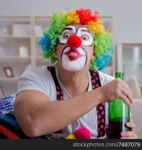 The drunk clown celebrating having a party at home. Drunk clown celebrating having a party at home