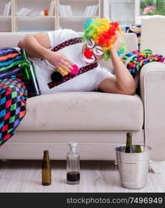 The drunk clown celebrating having a party at home. Drunk clown celebrating having a party at home