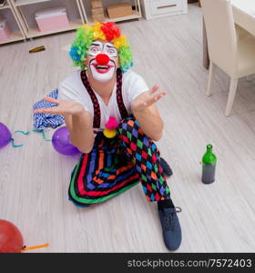 The drunk clown celebrating having a party at home. Drunk clown celebrating having a party at home