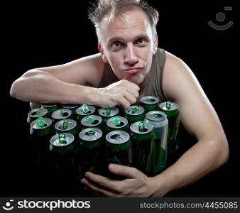 The drunk man and is a lot of empty beer cans