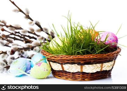 the easter eggs on fresh green grass and pussy willow