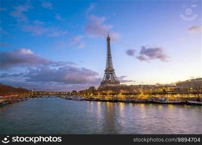 The Eiffel Tower and river Seine at twilight in Paris, France.
