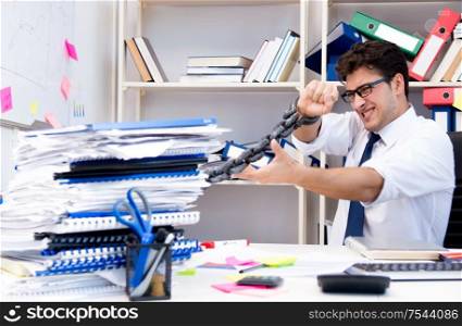 The employee attached and chained to his desk with chain. Employee attached and chained to his desk with chain