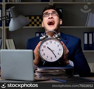 The employee staying late to finish work on auditing. Employee staying late to finish work on auditing