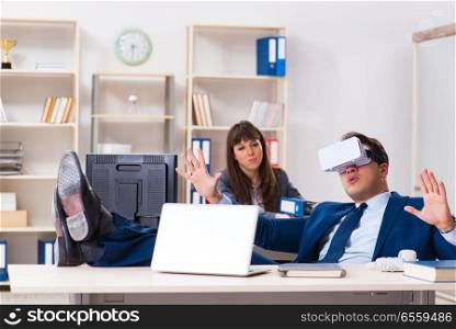 The employee with virtual reality glasses in office. Employee with virtual reality glasses in office