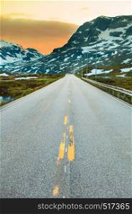 The empty road crossing the large Hardangervidda plateau in Norway.. road in Hardangervidda plateau in Norway.