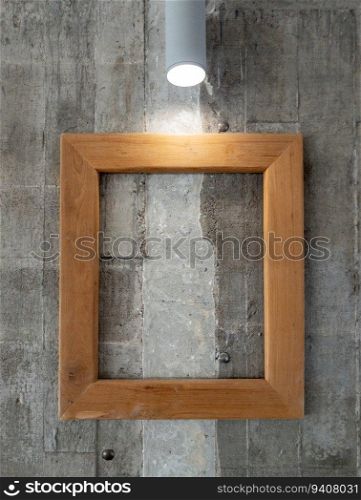 The empty wooden frame for decoration on the concrete wall in the coffee shop, front view with the copy space.