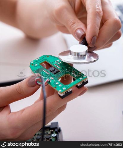 The engineer fixing broken computer hard drive. Engineer fixing broken computer hard drive