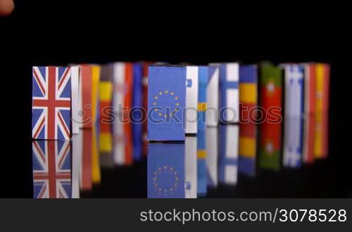 The Eu Dominos Fall. Flags of European Countries like a domino falling down