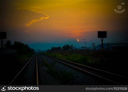 The evening sun shines on the beautiful railway.