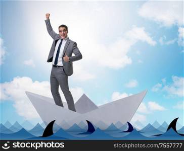 The excited businessman riding paper ship boat. Excited businessman riding paper ship boat