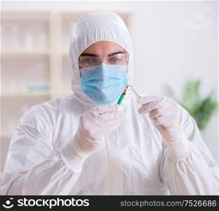 The expert criminologist working in the lab for evidence. Expert criminologist working in the lab for evidence
