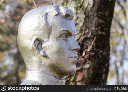 The face of the stone man. Concrete soldier bust covered with paint.. The face of the stone man. Concrete soldier bust covered with pa
