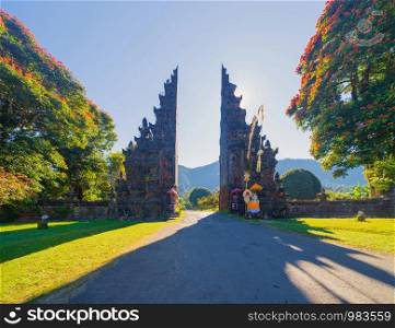 The famous Bali Handara. The Hindu Temple with ancient gate with pathway in park garden at noon. Hindu architecture landscape background of travel trip and holidays vacation in Indonesia.
