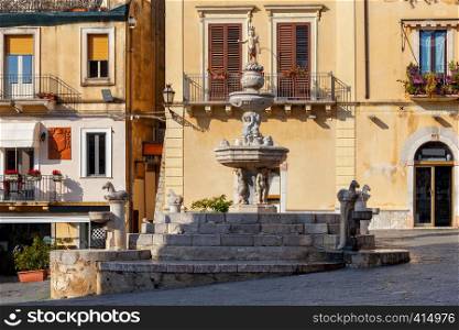 The famous city fountain in Taormina on the square on a sunny day. Italy. Sicily.. Taormina. Sicily. City fountain.