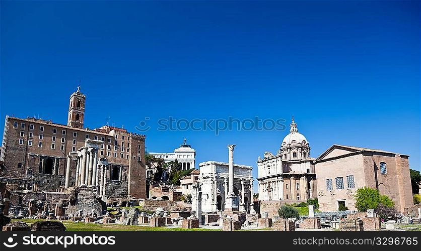 The famous italian landmarks: the Roman Forum, Rome. Large copy-space at the top.