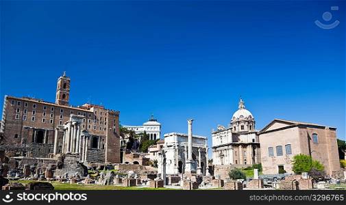 The famous italian landmarks: the Roman Forum, Rome. Large copy-space at the top.