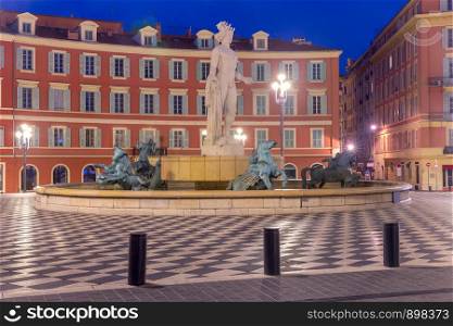 The famous Massena Square in the night lights at dawn. Nice. France. Cote d'Azur.. Nice. View of Massena Square in night lighting.